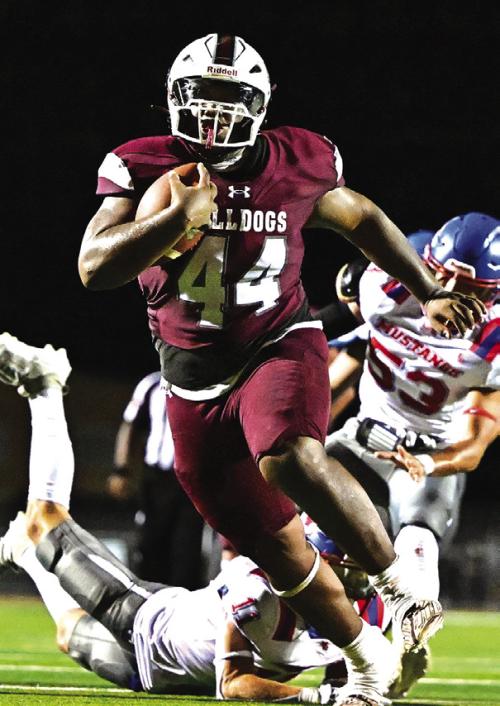 Flatonia High School senior football star Kobe Burton has announced that he has accepted a scholarship offer to play for The University of Texas Permian Basin. Burton ran for 793 yards and 14 touchdowns for the Bulldogs this season and led the team in total tackles with 108. Photo by Stephanie Steinhauser
