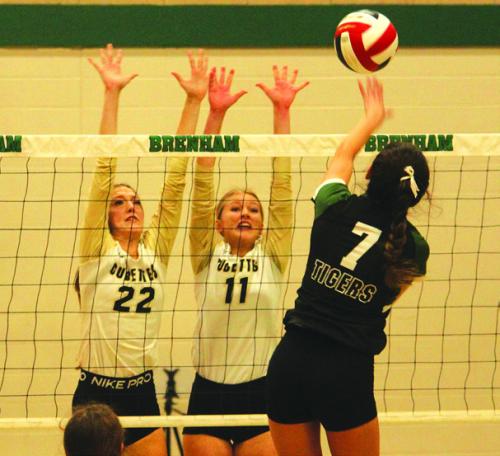 Round Top-Carmine’s Kennedy Flinn (22) and Jessica Rohde (11) jump to try to block this hit by Neches’ Juliana Carrizales in Saturday’s 1A regional final in Brenham. Photo by Jeff Wick