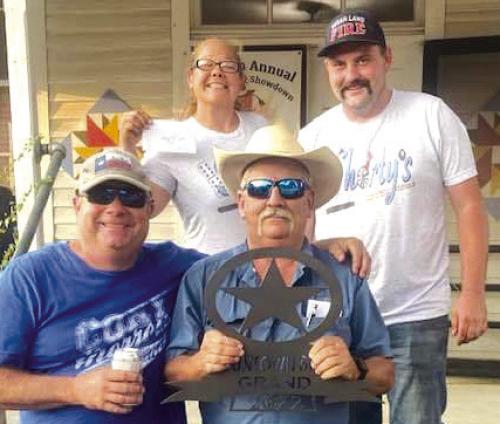 Grand Champion was awarded to the Double L Cookers, Lloyd Moreland, Chief Cook by Trish Herzog and Jake Franke.