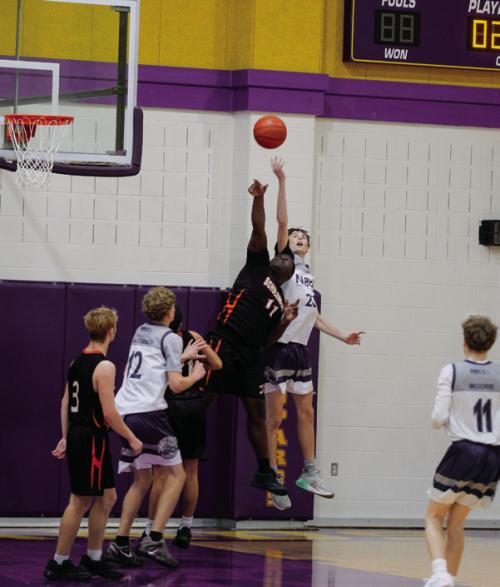 Schulenburg’s Cootie Ellison (11) fights for a rebound with a player from Northern Beaches Christian School, one of two Australian teams that competed in the Schmeckenfest Tournament.