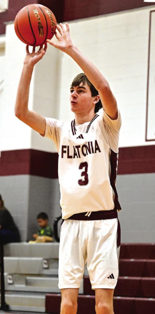 Flatonia’s Blake Kessler puts up three points for Flatonia in Friday’s boys win over Louise. Photo by Stephanie Steinhauser