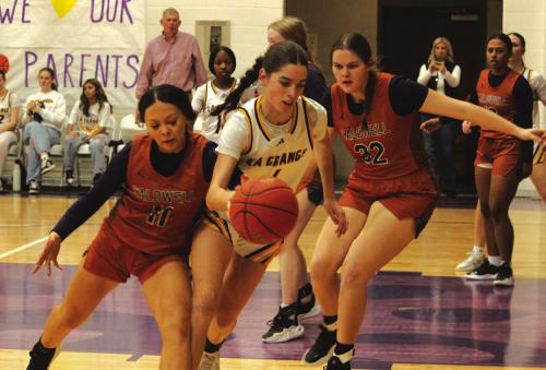 La Grange’s Macie Collier fights for control of the ball in Friday’s game against Caldwell. Photo by Jeff Wick