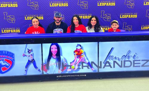 La Grange softball star Landri Hernandez signed her letter of intent to accept a scholarship to play for Hill College. She is shown at her signing ceremony Wednesday. Left to right: her sister Harli, her dad Noe Hernandez, Landri, her mom Kristi Sandoval and brother Rex. Photo by Jeff Wick
