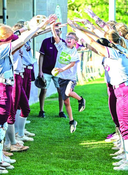 The Turtle Wing Foundation recently hosted more 2024 Turtle Wing Games where a child enrolled in special education gets to throw out the first pitch. Below is Gabriel Embrey with the Flatonia baseball team and above is Jax Laird during pregame introductions with the Flatonia softball team. Above photo by Stephanie Steinhauser