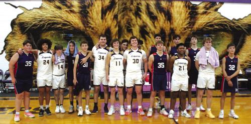 The members of the La Grange and Australian Pittwater House varsities pose after their basketball game Wednesday. Photo by Jeff Wick