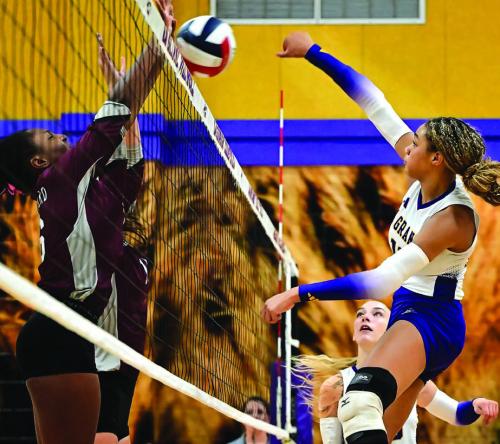 Brion Williams, right, battles at the net Tuesday night in La Grange’s sweep over East Bernard. Photo by Stephanie Steinhauser