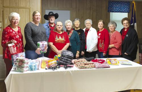 Pictured from left are Jeanette Schoenst, Kristi Bauer representing CASA, Mary Rauch, Earl Fenske, Lila Garlin, Linda Mattocks, Carmean Ebner, Jeanette Hancock, Pearlie Wagner, La Verne Albers.