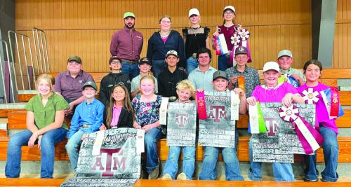 Pictured front from left: Hayleigh Pizzitola, Rowdy Guenther, Emma Zweschper, Abigale McBride, Joe Carrales, Hudson Holub, Kaisley Janecka, and Adalyn Carrales; middle row: Rilan Karisch, Tate Fritsch, Crockett Guenther, Dylan Zweschper, Logan Poncik, Holden Holub, and Abraham McBride; back row: Coach JoJo Carrales, Rheagan Karisch, Hailey Janish, and Tatum Fritsch.