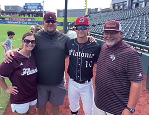 Letf to right: Titan’s parents Valerie and Matt Targac, Titan Targac and Flatonia Baseball Coach Shawn Bruns at Dell Diamond.