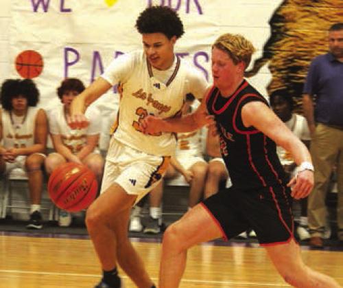 La Grange’s Brandon Mathis tries to grab a loose ball in the home finale against Smithville.