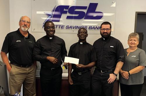 St. Rose Donates to Holy Rosary Rebuild
