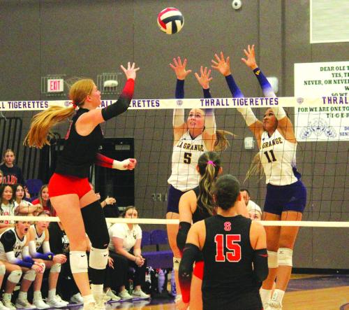 La Grange’s Campbell Cooper, center, and Brion Williams, right, try to block the hit of Salado’s Elsie Law, a 6-foot-2 University of Arkansas signee. Photo by Jeff Wick