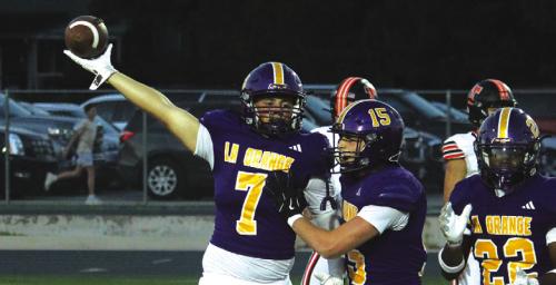 La Grange’s Christian Biles recovered two first half fumbles Friday. Here he holds one up for all to see. Photo by Jeff Wick