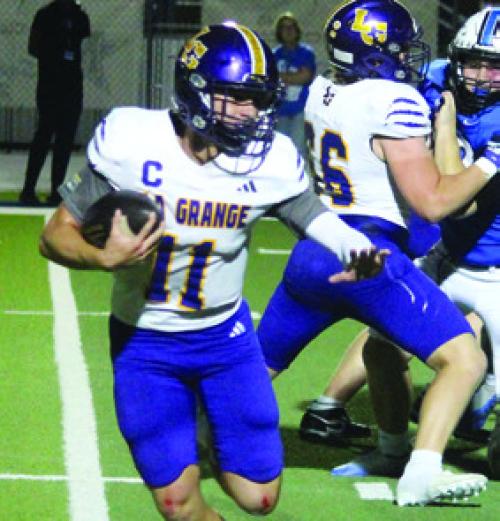 Leps quarterback Eli Gillum runs the ball Friday.