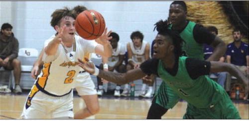 La Grange’s Caleb Norwood and Hempstead’s Jamarion Mickel battle for a loose ball Monday. Photo by Jeff Wick