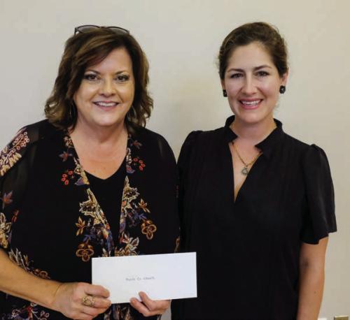Combined Community Action (CCA) received a $2,000 grant from the Texas Women’s League. Pictured are Kelly Franke of CCA (left) and Sofia Massey of TWL.
