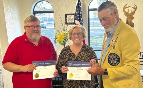 Debbie Grabsky, center, was inducted as a new member of the Carmine Lions Club by District Governor Julius Bartek, right. Also pictured is Daniel Grabsky, left, who was her sponsor.