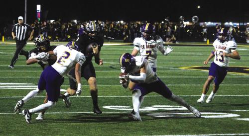 La Grange defensive players Dwodney Thompson (#2), Chris Supak (#5), Christian Biles (#7) and Van Hill (#13) converge on Sealy quarterback Kane Killough Friday. Photos by Jeff Wick