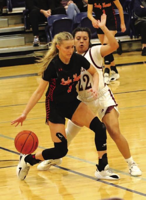 Schulenburg’s stellar girls basketball season came to an end Friday in Caldwell as the Lady Horns lost to Iola 47-42. The Lady Horns end their season with a 25-9 overall record. Here Jenna Guentert dribbles the ball during Friday’s playoff game. Photo by Audrey Kristynik