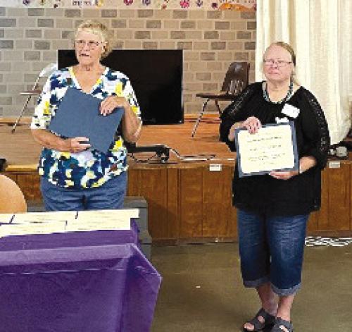 At the 2024 District 11 TEEA Spring Conference, Knellen Quinteros, District 11 Chairman (left) presented the District 11 Texas Treasure Award to Marilyn Petrich accepted by Marilyn’s daughter, Jesse Kokemor (right).