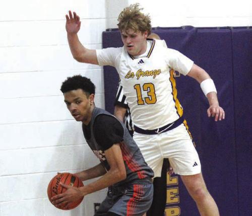 La Grange’s Conner Brooks plays defense against Gonzales in Tuesday’s game. Photo by Jeff Wick