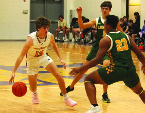 Photos by Jeff Wick Cole Collier looks for an opening against the Lexington defense Tuesday.