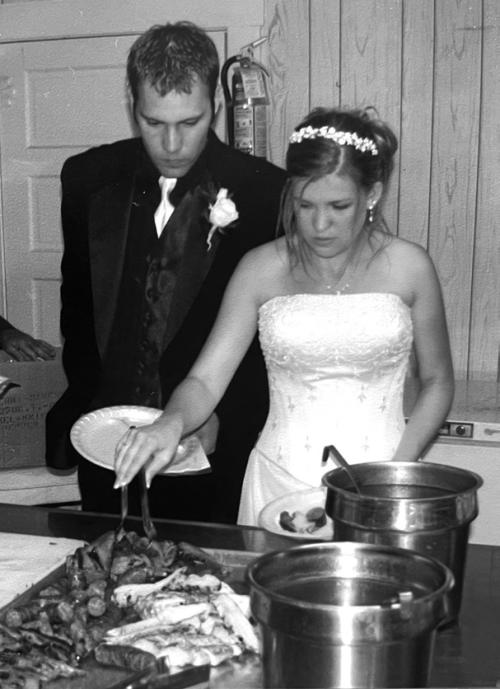 Jeff and Chrystal Wick dig into Mikeska’s barbecue 23 years ago at their wedding in High Hill.