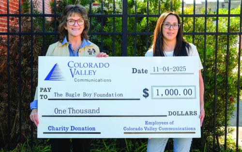 The employees of Colorado Valley Communications (CVC) presented a $1,000 donation to The Bugle Boy Foundation. On hand for the presentation were Bugle Boy Foundation Executive Director Heather Allbright (left) and CVC Customer Service Relations Rep. Daniela Zavala (right). CVC raises charity donation funds through voluntary contributions by employees. Staff photo by Andy Behlen