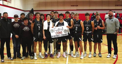 The members of the Fayetteville basketball team pose after Monday’s playoff victory.