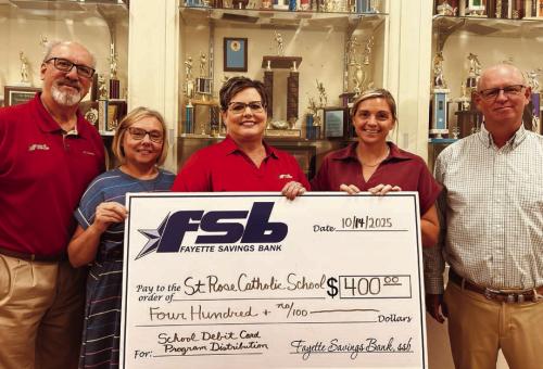 On hand as Fayette Savings Bank presented a check to St. Rose School (SRS) through its School Spirit Debit Card Program were (from left): Mike Olle, FSB; Michele Kubos, SRS Bookkeeper; Cheryl Brossmann, FSB; Taylor Jensen, SRS Principal; Gary Zweschper, SRS Advisory Council President.
