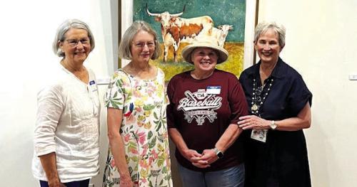 Art show participants from left: Darcia Mucha, Martha Dennis, Kathy Sauer, and Mary Quiros in front of longhorn painting by Kathy Sauer (not pictured Kathy Callaway).