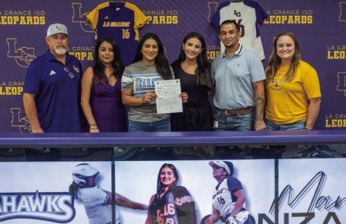 La Grange pitcher Marissa Gonzales signed a letter of intent to play softball at Lamar State College in Port Arthur. La Grange High School hosted a signing ceremony for her on Monday, May 20. Pictured above are La Grange Softball Coach Robert Young, mother Annabelle Gonzales, Marissa Gonzales, sister Melissa Gonzales, father Frank Gonzales and La Grange Assistant Softball Coach Hannah Gerecke. Photo by Andy Behlen