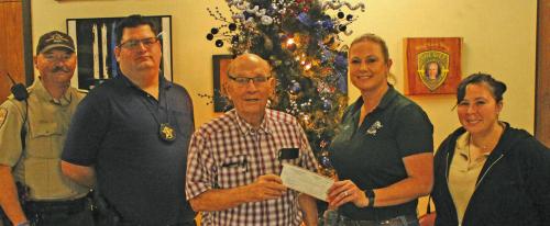 The St. James Men’s club made a $500 donation to the Deputy Santa program this week. Shown above, left to right, are: Sgt. Ron Naumann, Investigator Jeremy Castleberry, Dick Frenzel of the St. James Men’s Club. Sgt. Angela Lala and Dispatcher Sonya Lehmann.