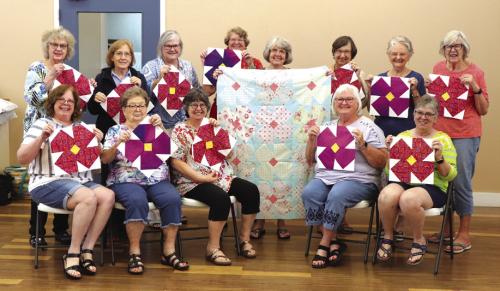 CVQG “Hugs For Texas” Project – (standing, from left) Janice Raabe, Gay Dobbs, Rachel Mancill, Debbie Huebel, Kathy Theut, Barbara Schellberg, Pat Scherer, Brigitte Mesecke (seated) Dawn Allison, Kathy Bertsch, Kathi Babcock, Linda Polk, and Sandy Courrier.