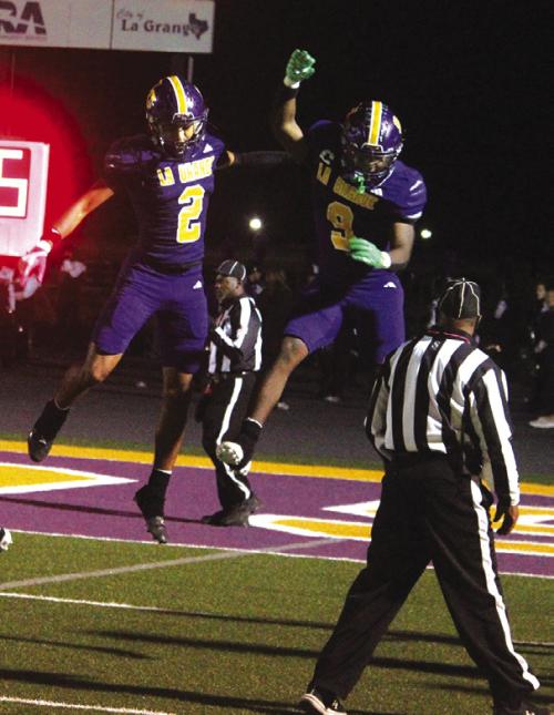 La Grange’s Dwodney Thompson, left, and Dillan Johnson, right celebrate after one of Thompson’s two touchdown catches in the second quarter. Photos by Jeff Wick