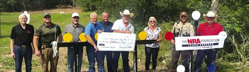 Pictured (from left) are Charlie Murray, Investigator Kenn Kretz, John Salem, Dennis Brower, Craig Schulz, Sheriff Keith Korenek, Lazy Q Manager Lori Gray, Sgt. Ron Naumann and Lt. David Beyer.