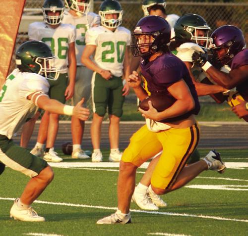 Left: La Grange quarterback Clayton Cooper scrambles for yardage in last week’s scrimmage against Franklin. Photo by Jeff Wick