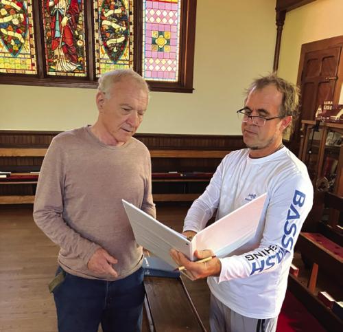Director John Saunders (right) discussing script with congregant and veteran NPR Morning Edition commentator, Austin Bay.