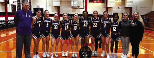 The members of the La Grange girls basketball team pose with their trophy after winning the tournament in Brazos Saturday.