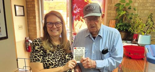 Albert Loehr, above, and Brian Cox, below, split last week’s reader football pick-it prize. Both got all 10 games right and tied on the score prediction tiebreaker. They are shown here accepting their $50 prizes from Record publisher Regina Keilers.