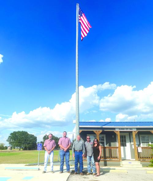 The flag pole and installation was recently donated by Hahn Construction at the Ellinger City Hall, 101 W. Shumacher. Pictured above is Kenny Stojanik, Cullen Weishuhn, Matt Mikulenka, Jason Hahn and Paloma Hahn.