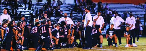 Schulenburg head coach Luke Hobbs talks to his players after their district win two weeks ago against Kenedy. Photo by Andy Behlen