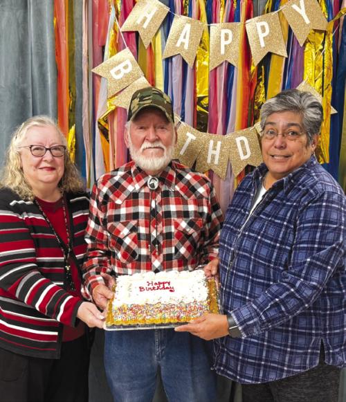 Out of 27 members celebrating birthdays in the month of February, these three braved the ice cold temperatures to get a slice of this cake brought by Cynthia Trojacek. Pictured are Kitra Ruiz and her husband Steve, and Cindy Villarreal. All of the birthday honorees will receive a birthday card signed by many members to brighten their day.