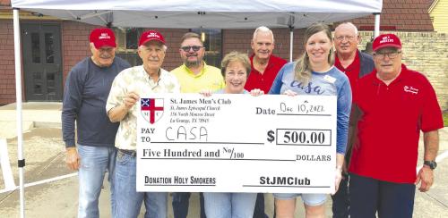The Men’s Club of Saint James’ held a drive-thru fundraiser for CASA (Court Appointed Special Advocates of Bastrop, Fayette and Lee Counties). Pictured from left is: Tom Tracy, Dan Boyles, Mike York, CASA board member, Karen Mahoney-Woods, CASA board member, Guy Mason, Kristi Bauer, Executive Director of CASA, Ed Dykes, and Jim Malik.