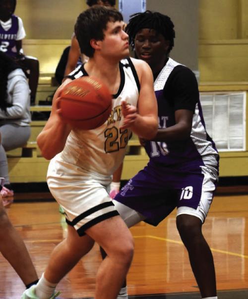 Round Top-Carmine’s Cash Robertson looks to make a pass in Friday’s victory over Calvert. Photo by Paul Kipp