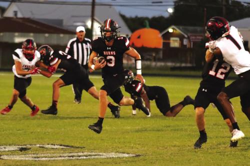 Schulenburg quarterback Aaron Janecek takes advantage of blocking to find some running room in Friday’s victory. Photo by Audrey Kristynik