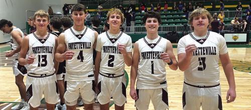 The senior members of the Fayetteville boys basketball team all hold up a piece of the net they cut down after Monday’s state semifinal victory. Left to right, Cole Jurecka, Jack Schley, Kole Schmitt, Mason Fenhaus and Kasen Kocian. Photo by Jeff Wick