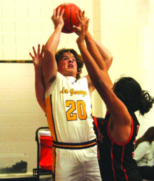 La Grange’s Christian Biles goes to the hoop in Friday’s game. Photo by Jeff Wick
