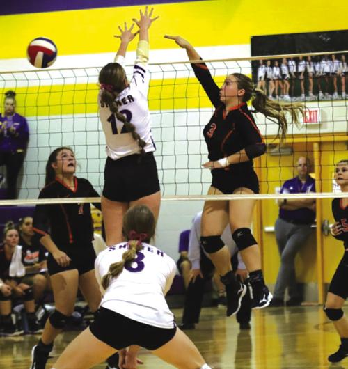 Schulenburg’s Reagan Dusek spikes a ball in Tuesday’s match at Shiner.