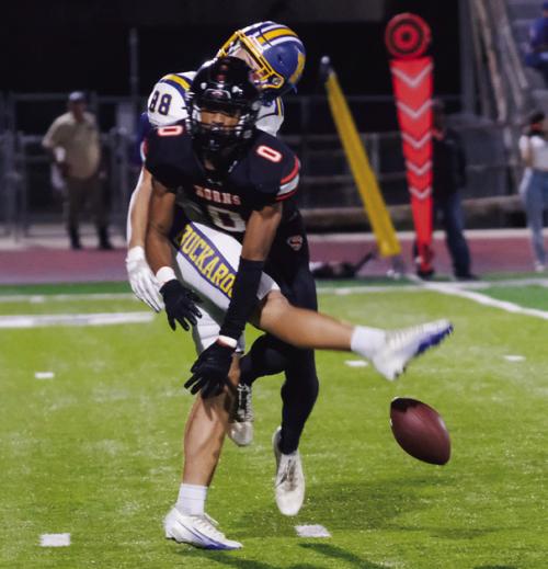 Jakele Houston blocks a punt in the first quarter.